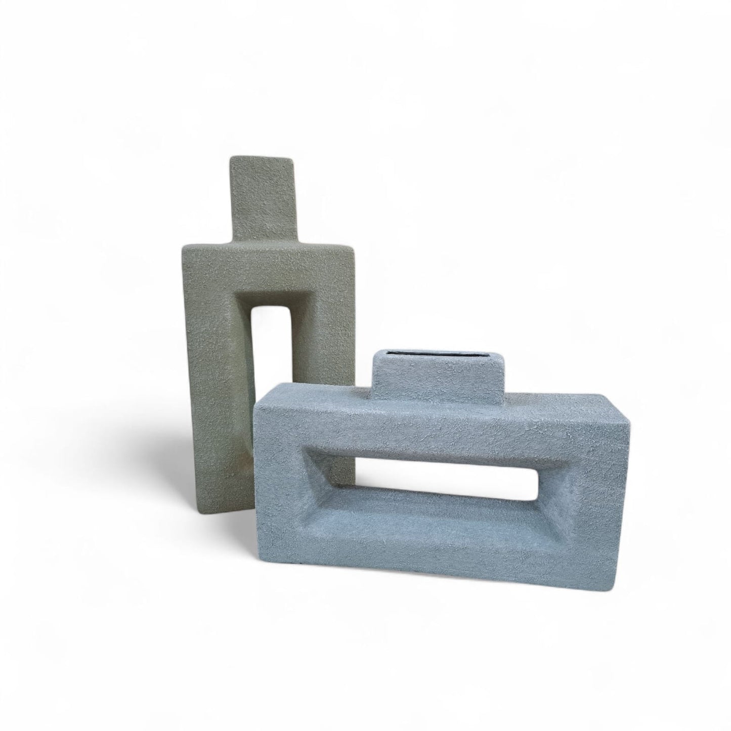 Two gray geometric ceramic vases on a white background