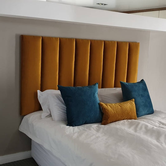 gold panelled headboard