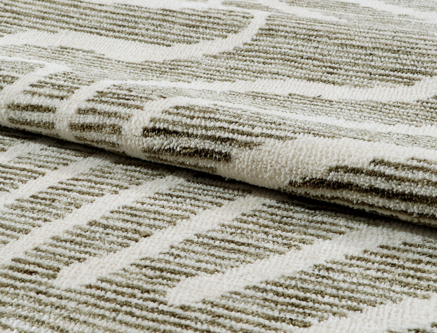 Close-up of textured rug with geometric pattern