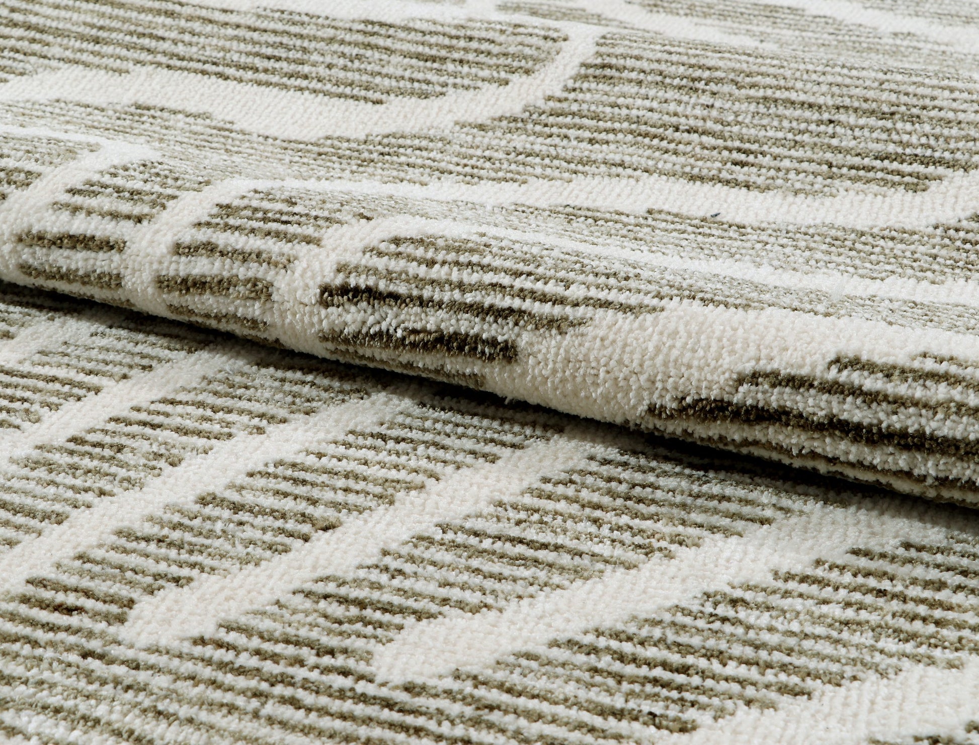 Close-up of textured rug with geometric pattern