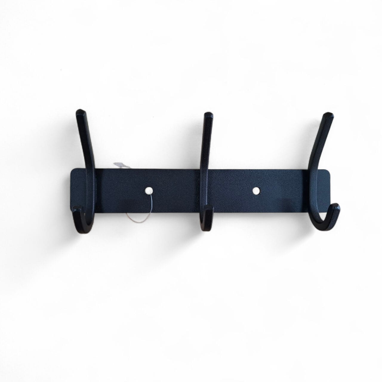 Navy blue wall-mounted coat rack with four hooks on a white background