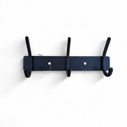 Navy blue wall-mounted coat rack with four hooks on a white background