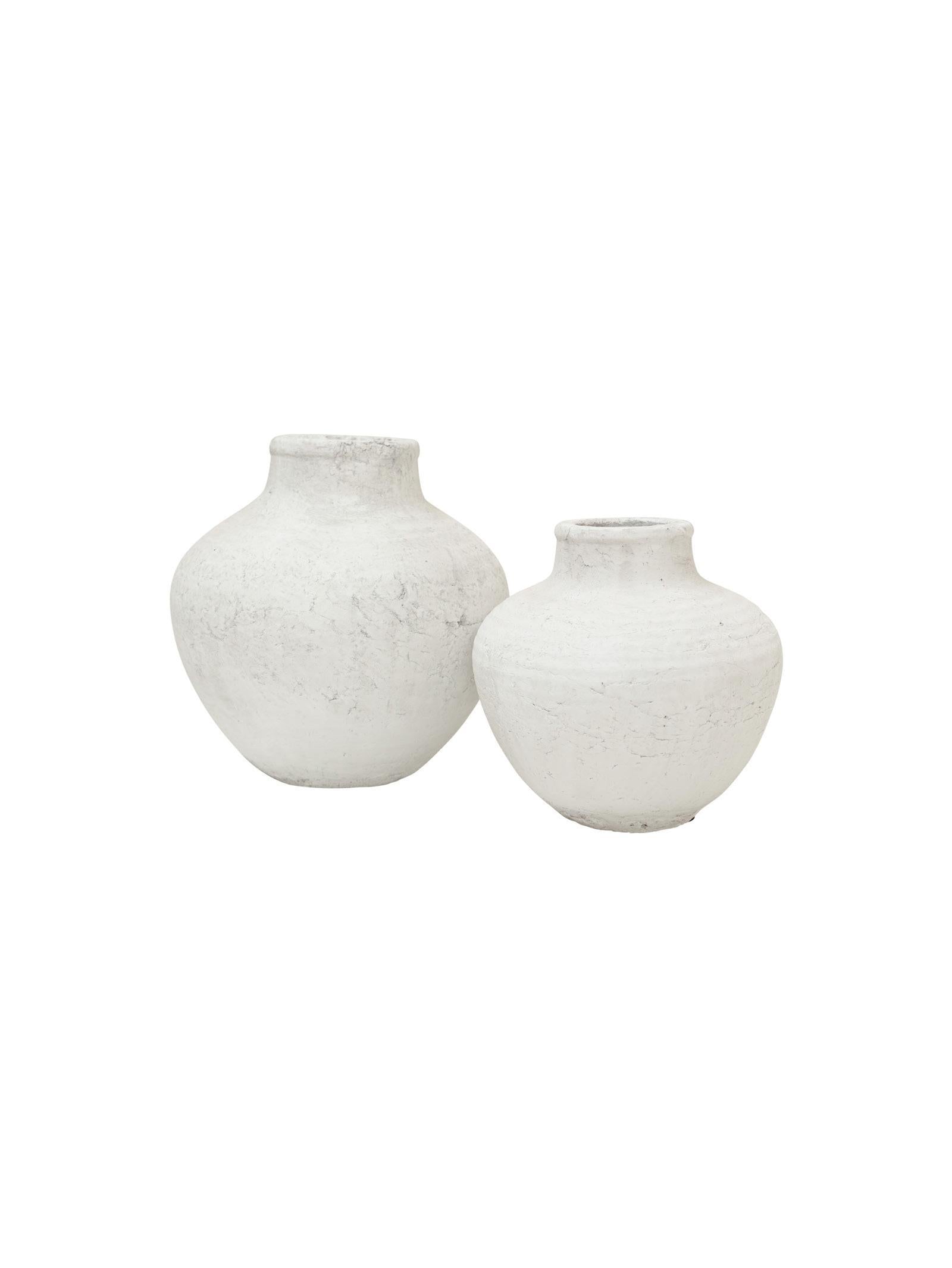 Two white textured vases on a white background