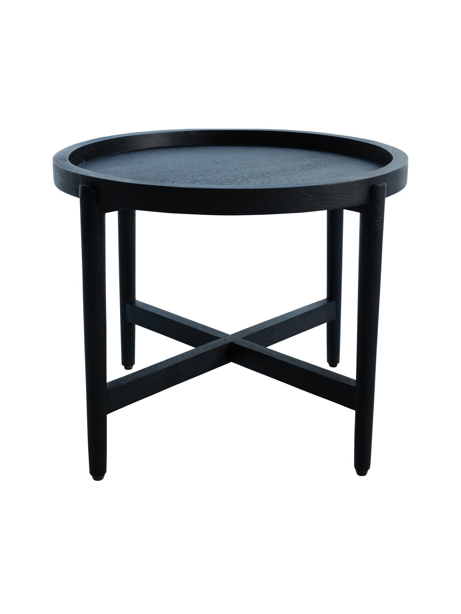 Black round side table on a white background