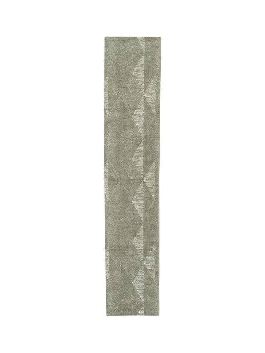 Long, narrow runner rug with geometric pattern on a white background