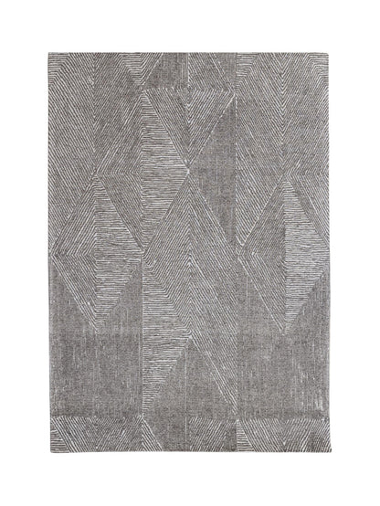 Gray geometric patterned rug on a white background