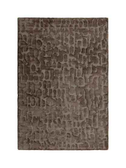 A rectangular area rug with an abstract, textured pattern in shades of taupe, brown, and gray, shown flat against a solid white background.