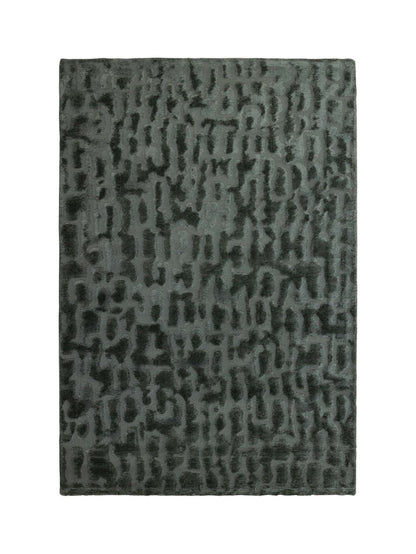 A rectangular area rug with an abstract, textured pattern in shades of dark gray and muted green, shown flat against a plain white background.