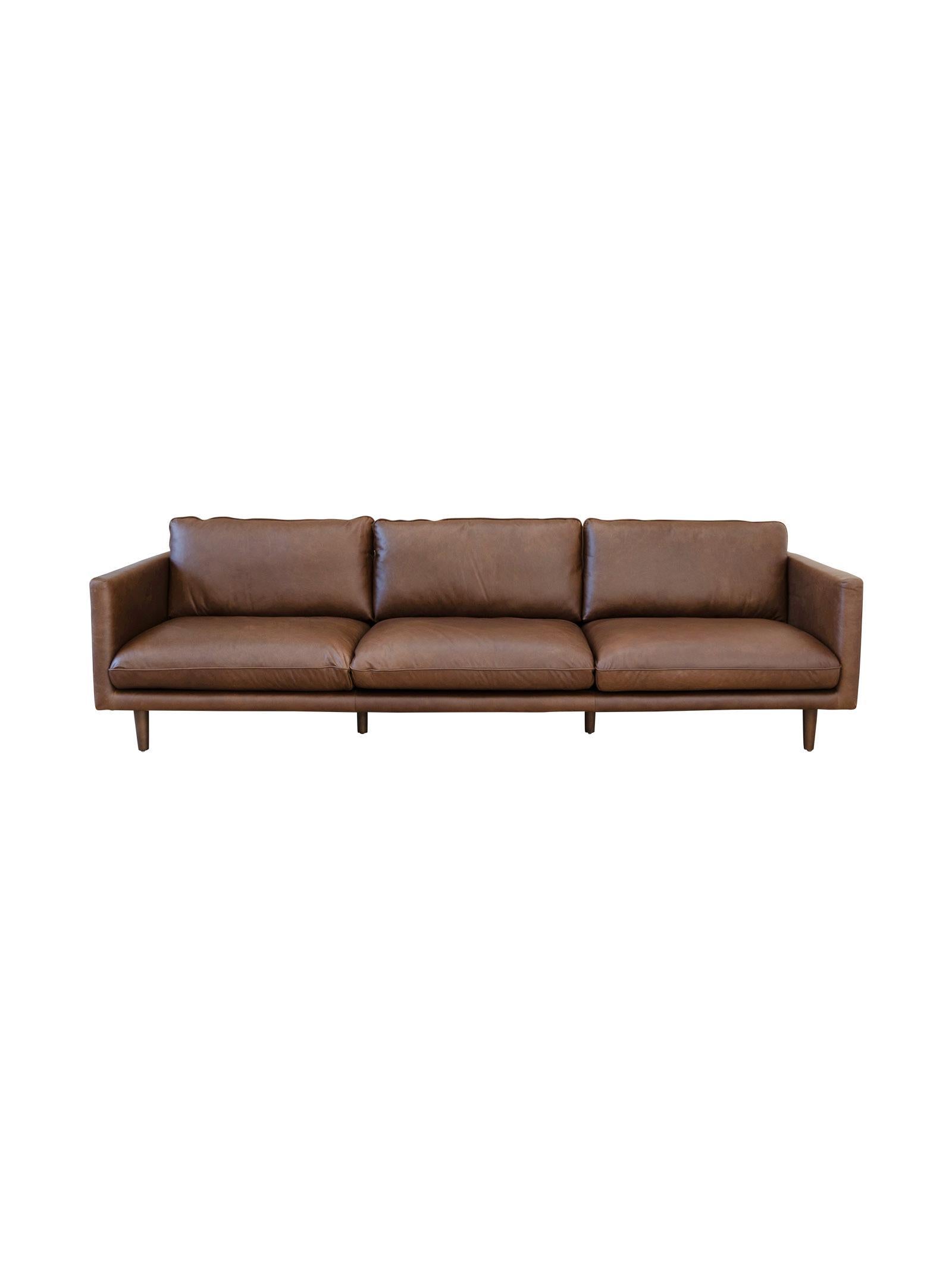 Brown leather sofa on a white background