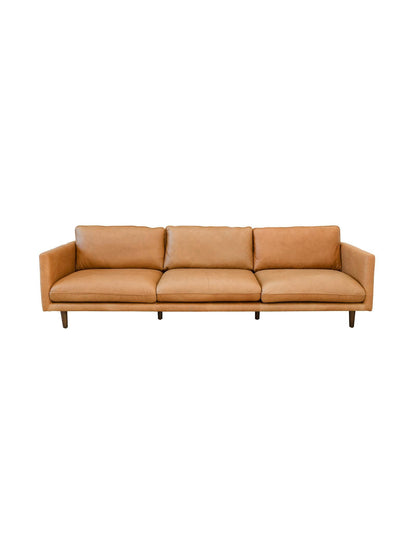 Tan leather sofa on a white background