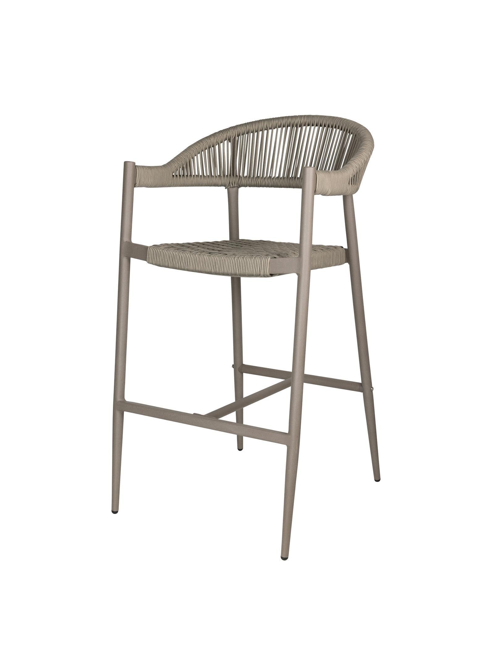 Iona Outdoor Bar Chair with aluminium frame and woven UV-resistant rope seat on patio

Close-up of Iona bar chair showing detailed rope weave and metal frame

Set of Iona outdoor bar chairs arranged around outdoor bar counter

Iona Outdoor Bar Chair styled on wooden deck with scenic outdoor background

Back view of Iona bar chair highlighting UV-resistant rope backrest design

Iona bar chair from the Iona outdoor furniture collection with coordinating pieces