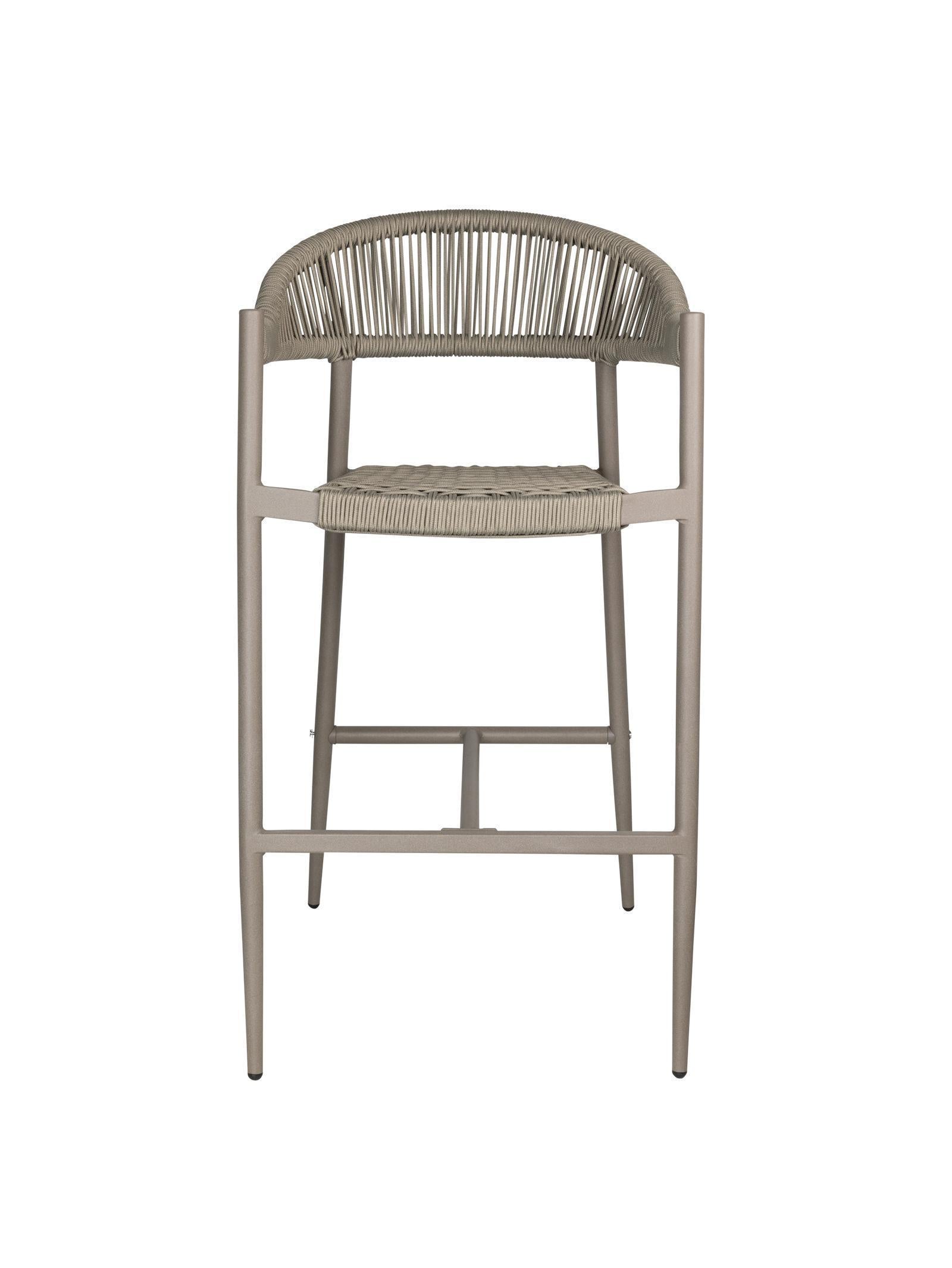 Iona Outdoor Bar Chair with aluminium frame and woven UV-resistant rope seat on patio

Close-up of Iona bar chair showing detailed rope weave and metal frame

Set of Iona outdoor bar chairs arranged around outdoor bar counter

Iona Outdoor Bar Chair styled on wooden deck with scenic outdoor background

Back view of Iona bar chair highlighting UV-resistant rope backrest design

Iona bar chair from the Iona outdoor furniture collection with coordinating pieces