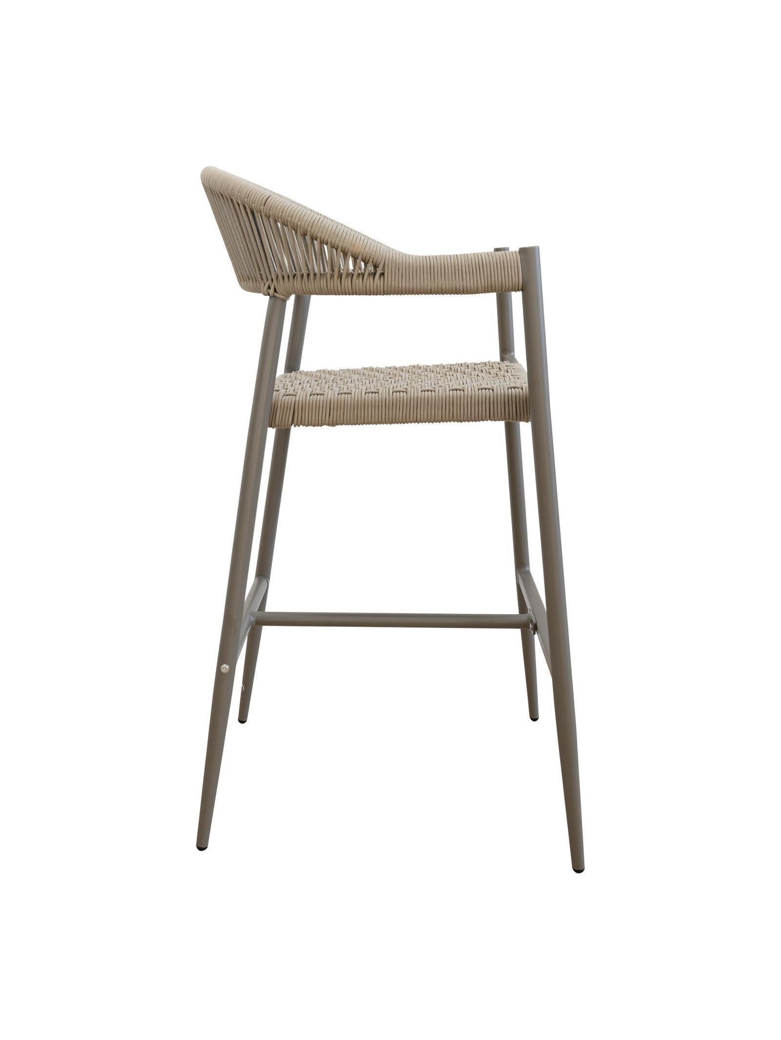 Iona Outdoor Bar Chair with aluminium frame and woven UV-resistant rope seat on patio

Close-up of Iona bar chair showing detailed rope weave and metal frame

Set of Iona outdoor bar chairs arranged around outdoor bar counter

Iona Outdoor Bar Chair styled on wooden deck with scenic outdoor background

Back view of Iona bar chair highlighting UV-resistant rope backrest design

Iona bar chair from the Iona outdoor furniture collection with coordinating pieces