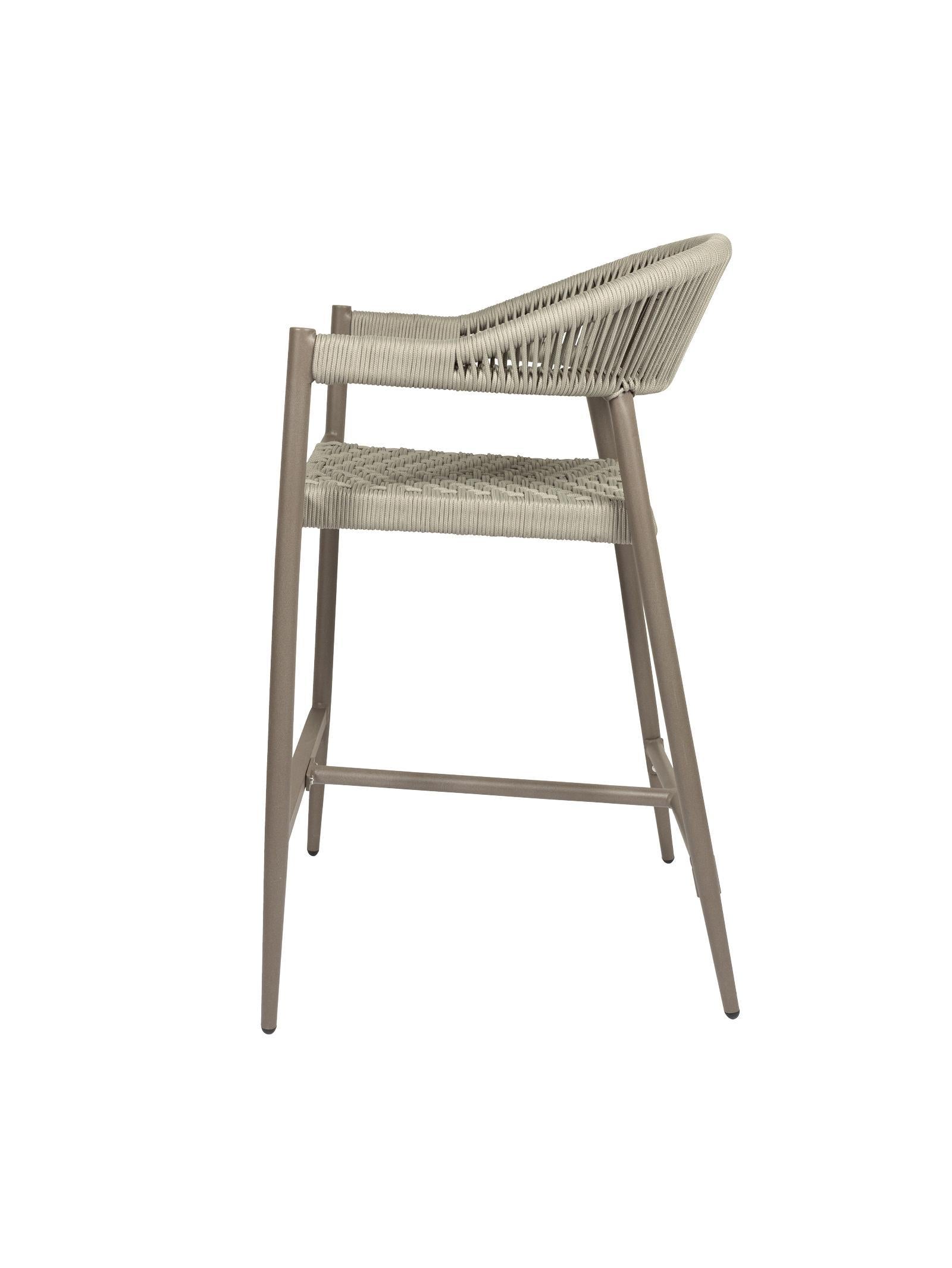 Iona Outdoor Counter Chair with aluminium frame and woven UV-resistant rope seat on patio

Close-up of Iona counter chair showing detailed rope weave and metal frame

Pair of Iona outdoor counter chairs at outdoor kitchen counter or bar area

Iona Outdoor Counter Chair styled on deck with scenic outdoor backdrop

Back view of Iona counter chair highlighting UV-resistant rope backrest design

Iona counter chair from the Iona outdoor furniture collection with matching pieces