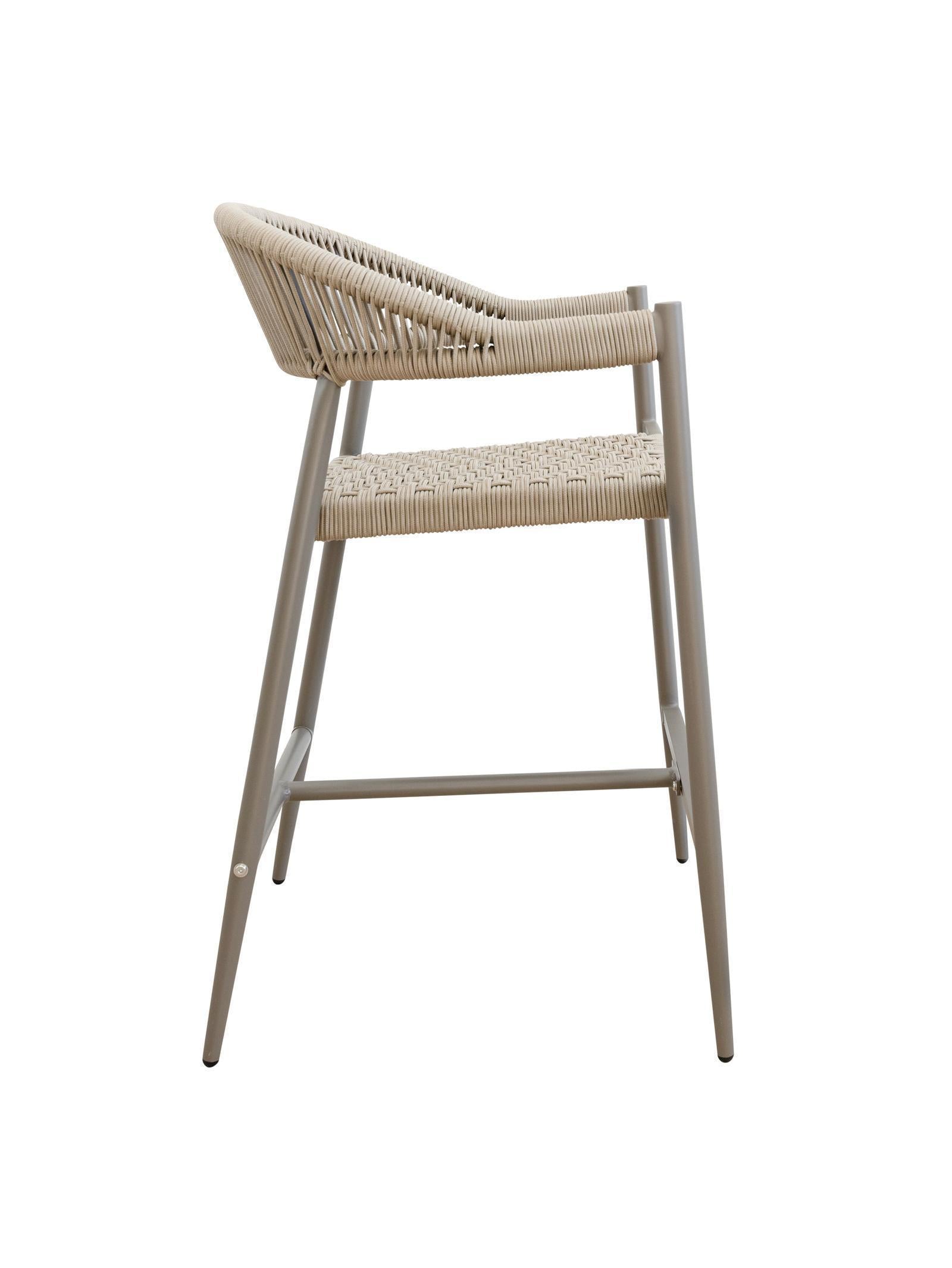 Iona Outdoor Counter Chair with aluminium frame and woven UV-resistant rope seat on patio

Close-up of Iona counter chair showing detailed rope weave and metal frame

Pair of Iona outdoor counter chairs at outdoor kitchen counter or bar area

Iona Outdoor Counter Chair styled on deck with scenic outdoor backdrop

Back view of Iona counter chair highlighting UV-resistant rope backrest design

Iona counter chair from the Iona outdoor furniture collection with matching pieces