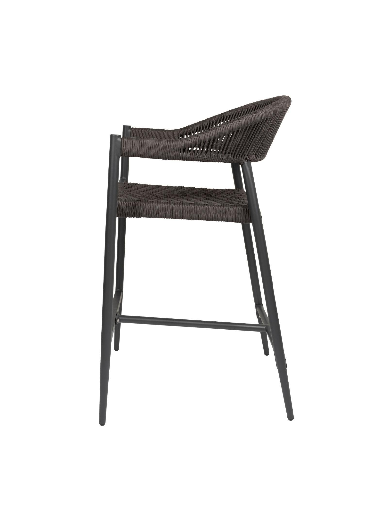 Iona Outdoor Counter Chair with aluminium frame and woven UV-resistant rope seat on patio

Close-up of Iona counter chair showing detailed rope weave and metal frame

Pair of Iona outdoor counter chairs at outdoor kitchen counter or bar area

Iona Outdoor Counter Chair styled on deck with scenic outdoor backdrop

Back view of Iona counter chair highlighting UV-resistant rope backrest design

Iona counter chair from the Iona outdoor furniture collection with matching pieces