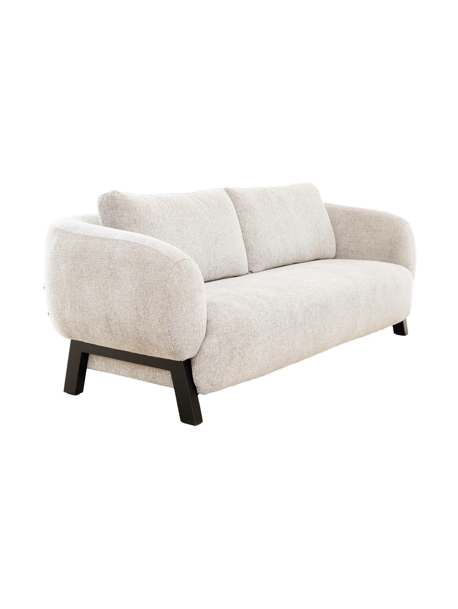 Beige sofa with black legs on a white background