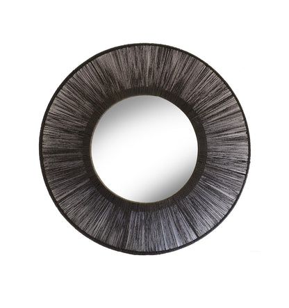Round mirror with a textured black frame on a white background