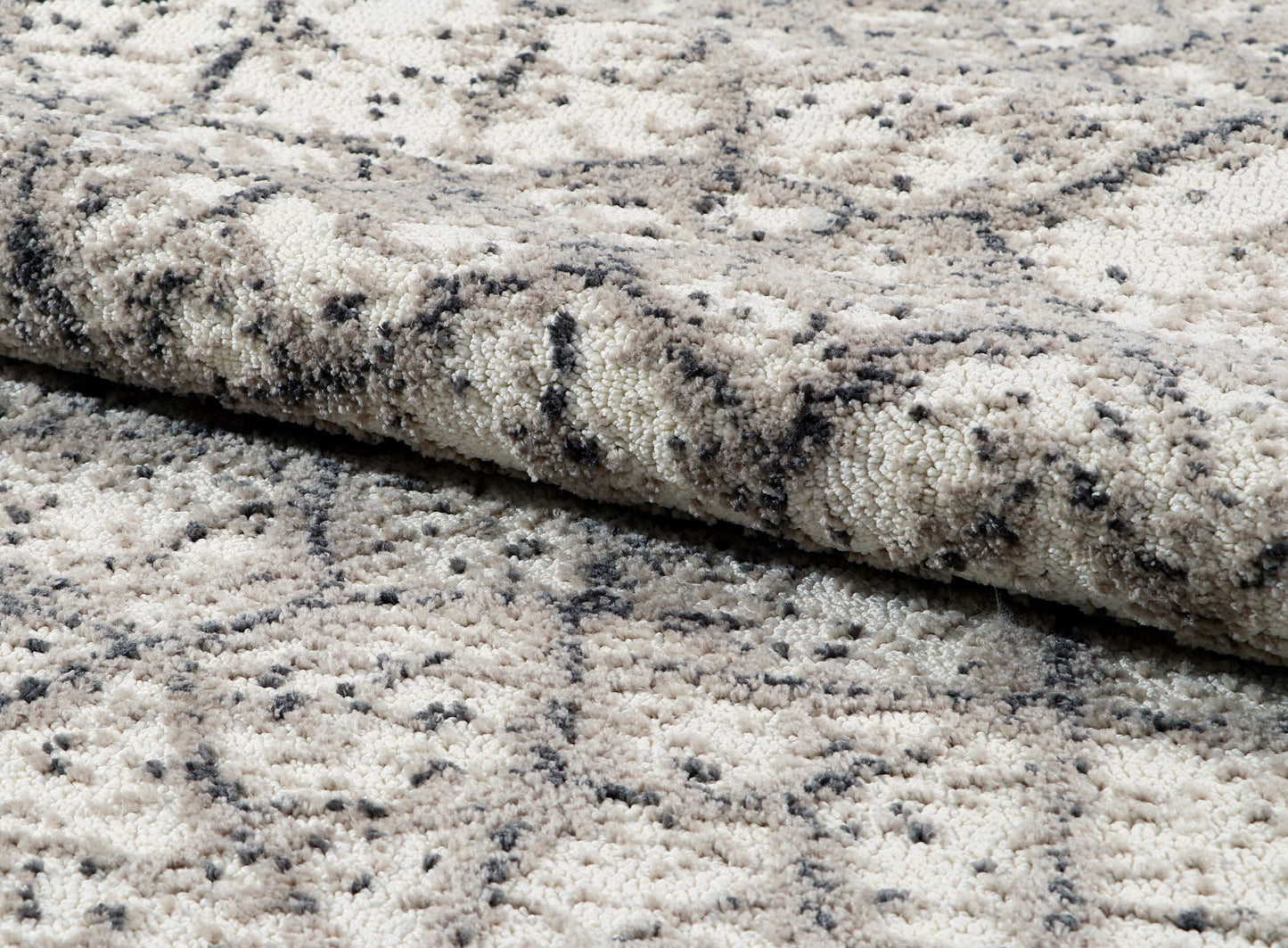 Close-up of textured gray and black rug