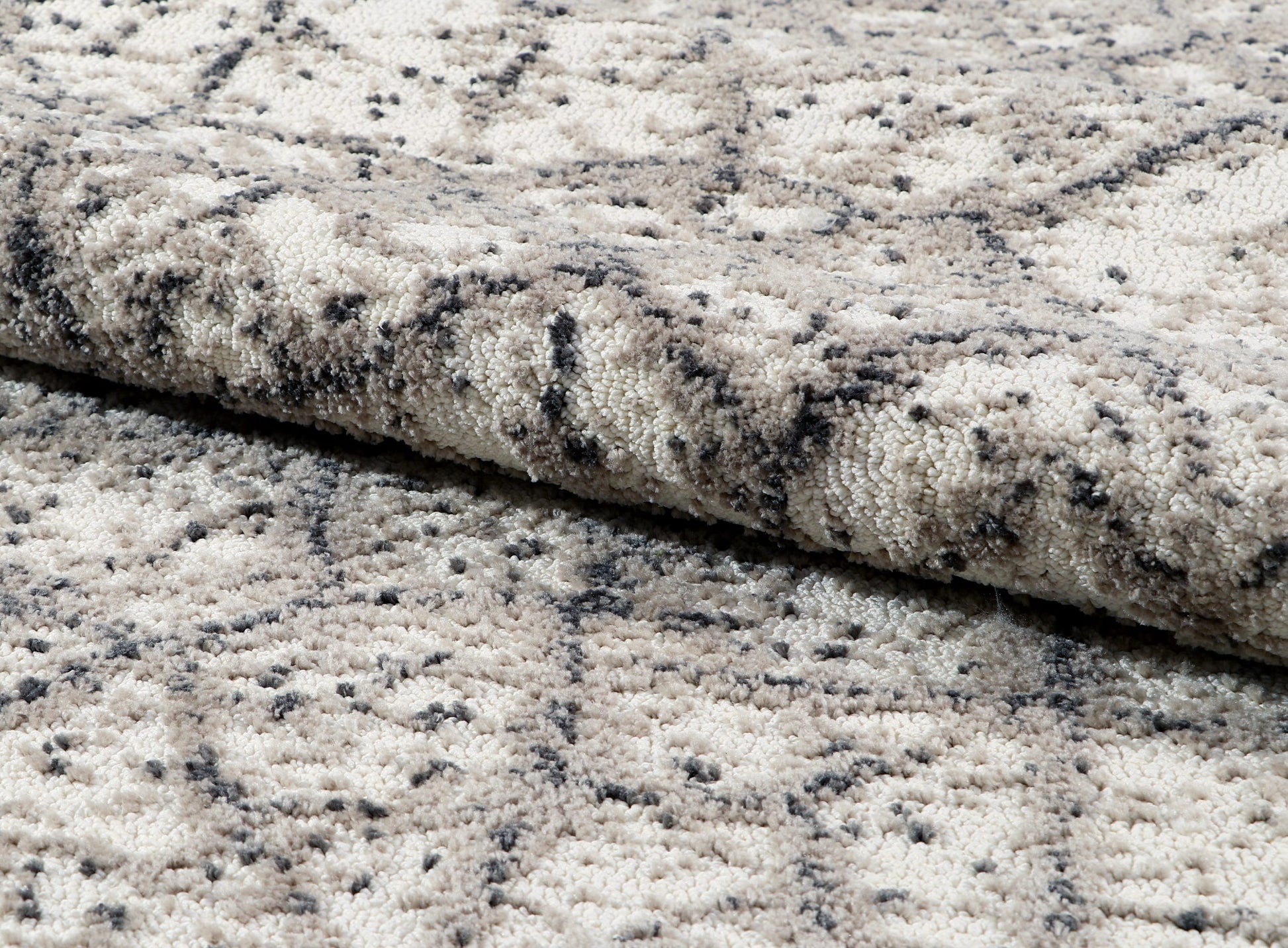 Close-up of textured gray and black rug