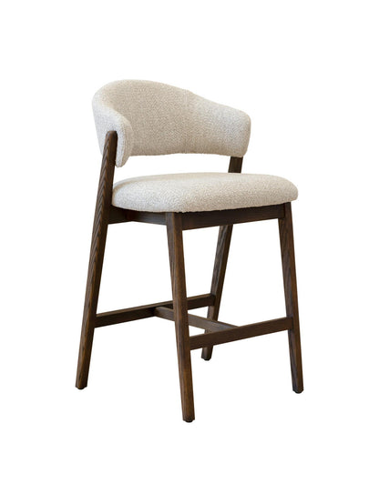 Counter stool with beige cushioned seat and backrest on a white background