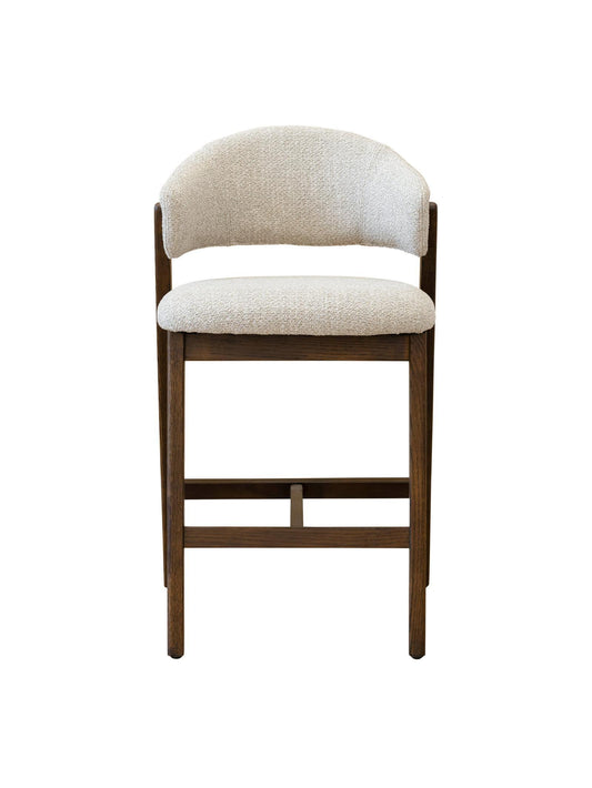 Counter stool with beige cushioned seat and backrest on a white background