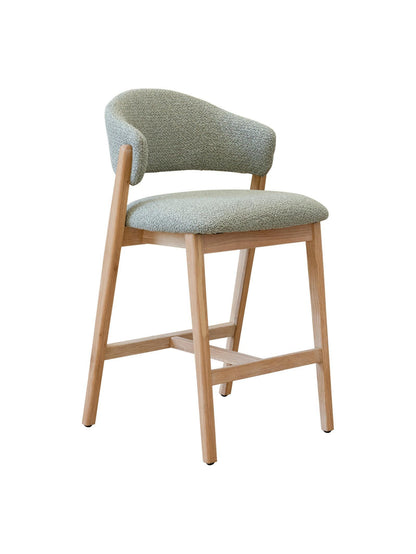 Counter stool with Sage cushioned seat and backrest on a white background