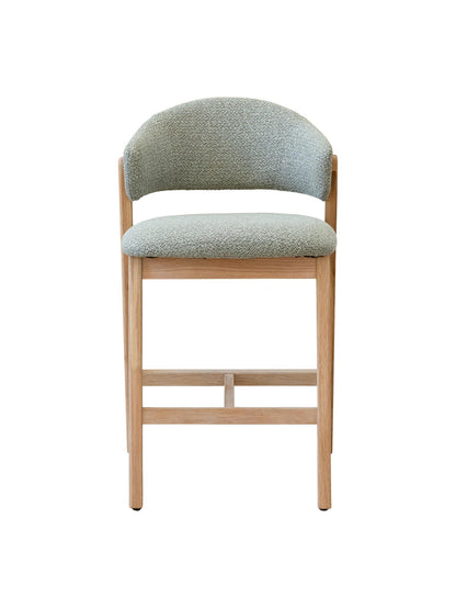 Counter stool with Sage cushioned seat and backrest on a white background