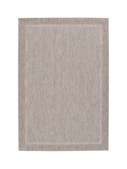 Textured area rug with a geometric pattern on a white background