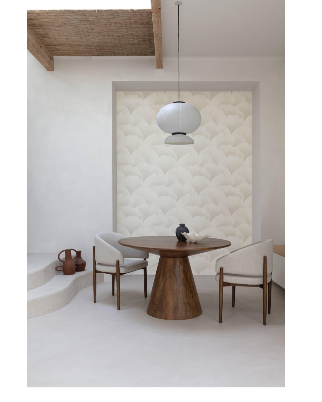 Modern dining area with a wooden table and chairs in a minimalistic setting.