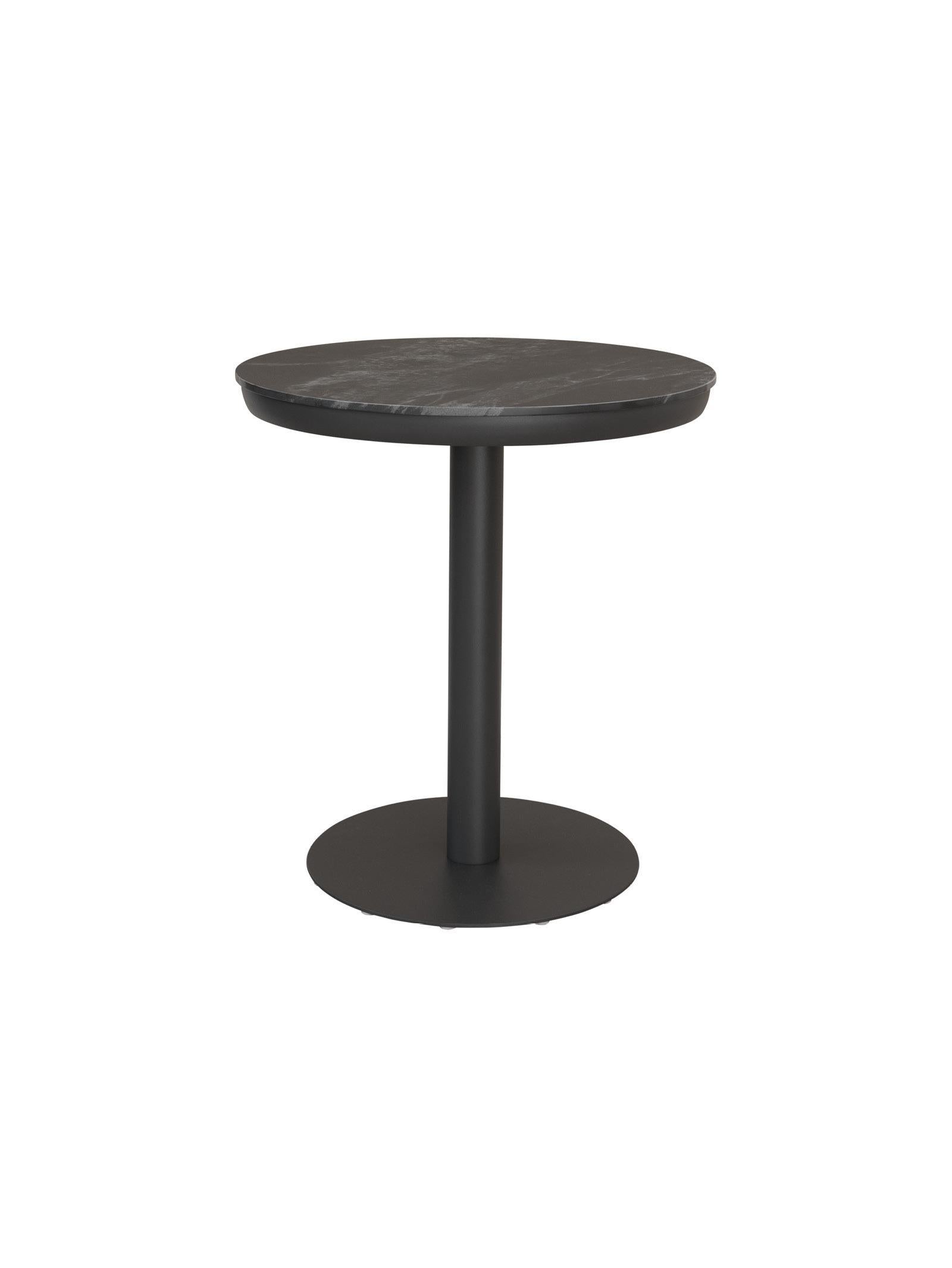 Black round side table on a white background