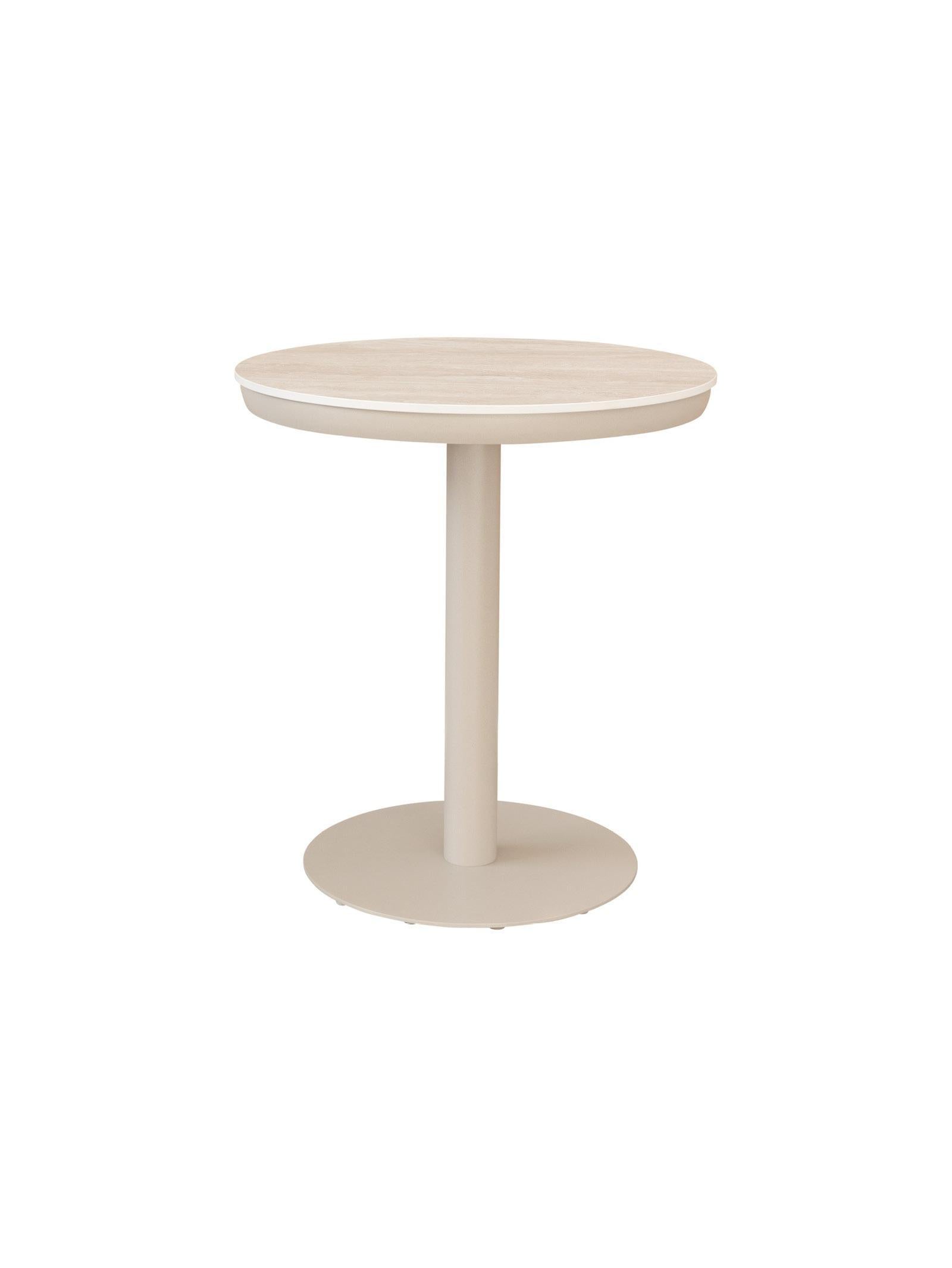 Round side table with a white base and beige top on a white background