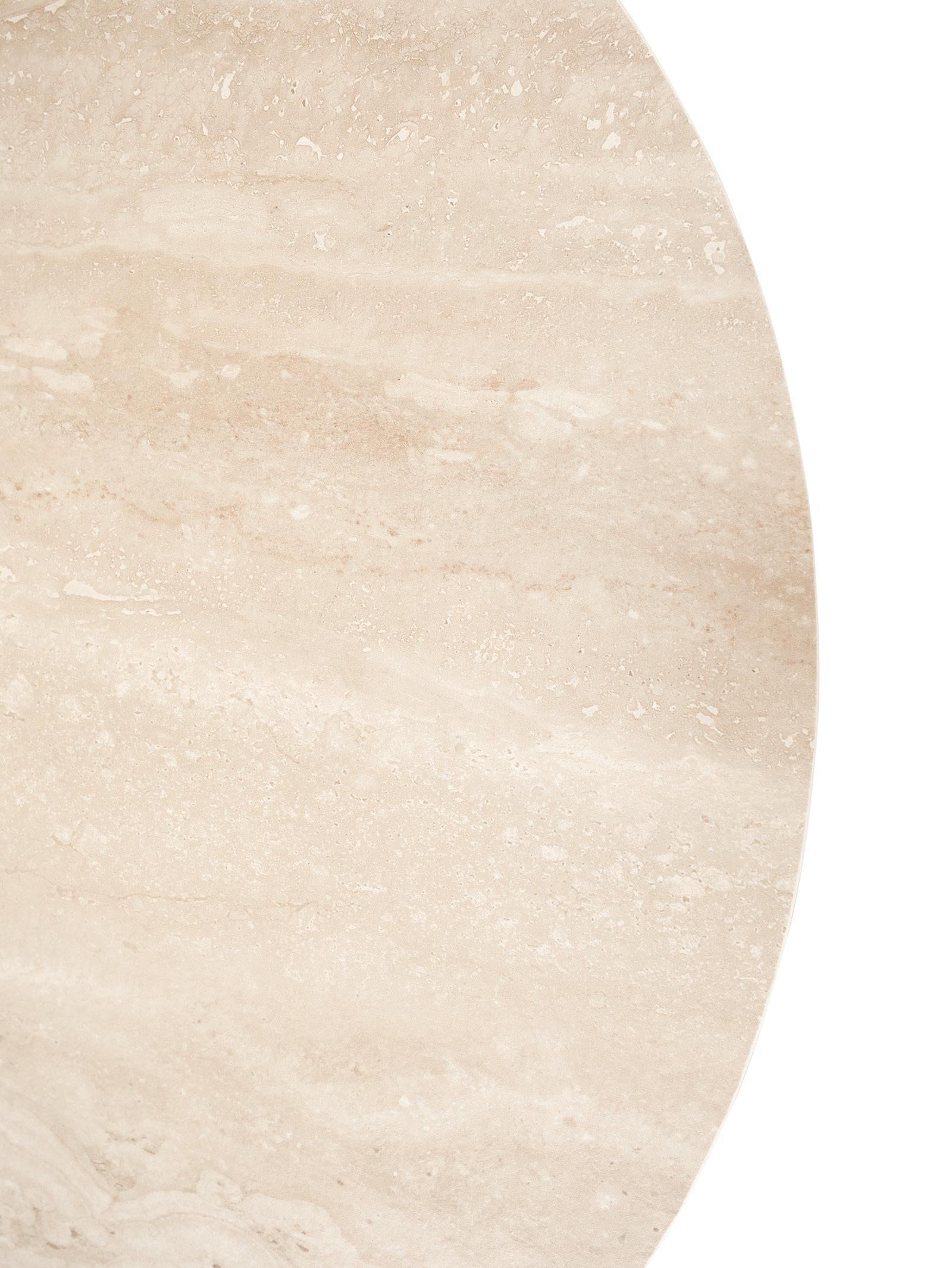 Close-up of a beige stone surface with a circular cutout