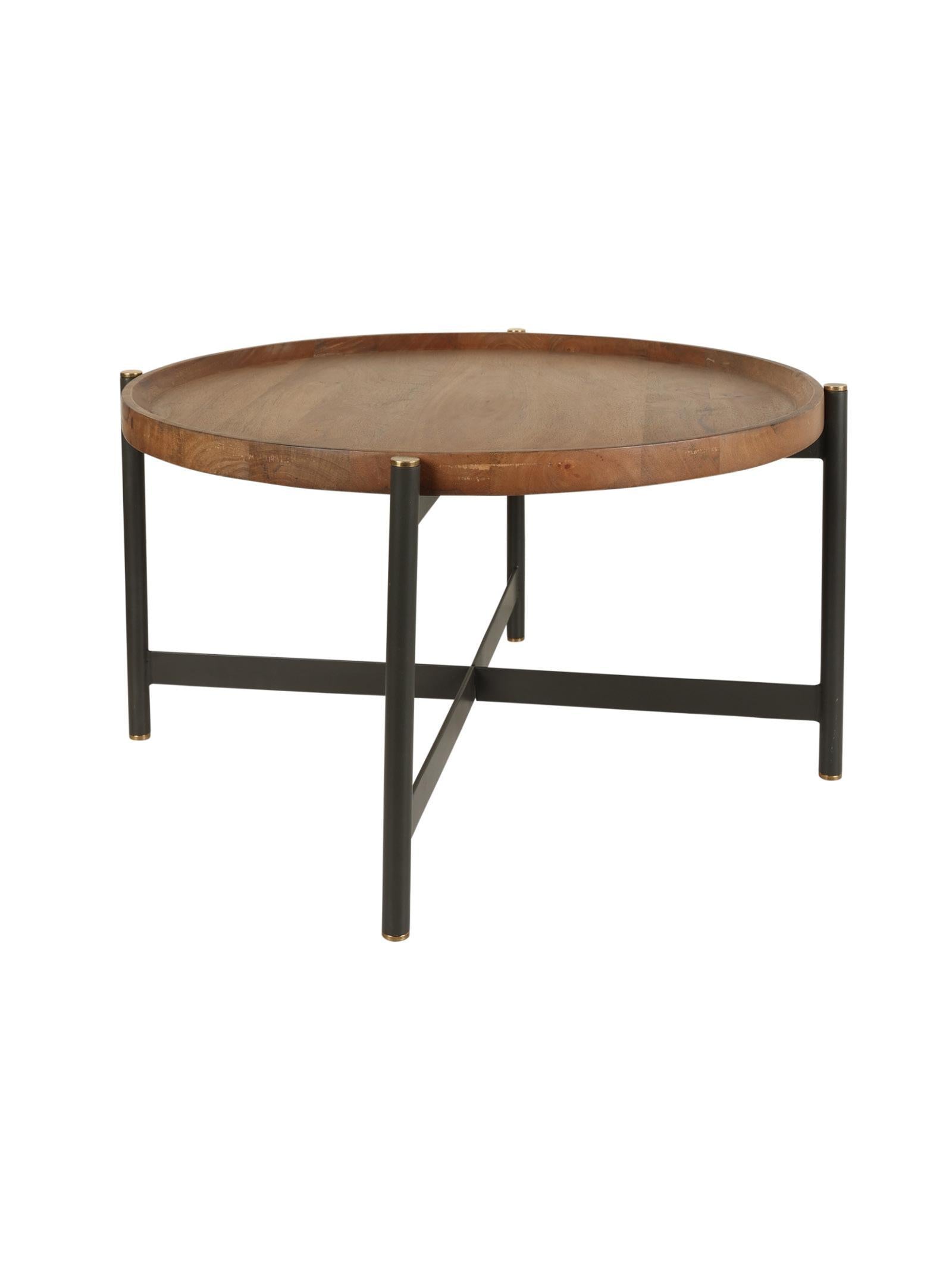 Round wooden table with metal legs on a white background