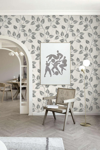 Modern interior with leaf-patterned wallpaper, a chair, and a floor lamp.