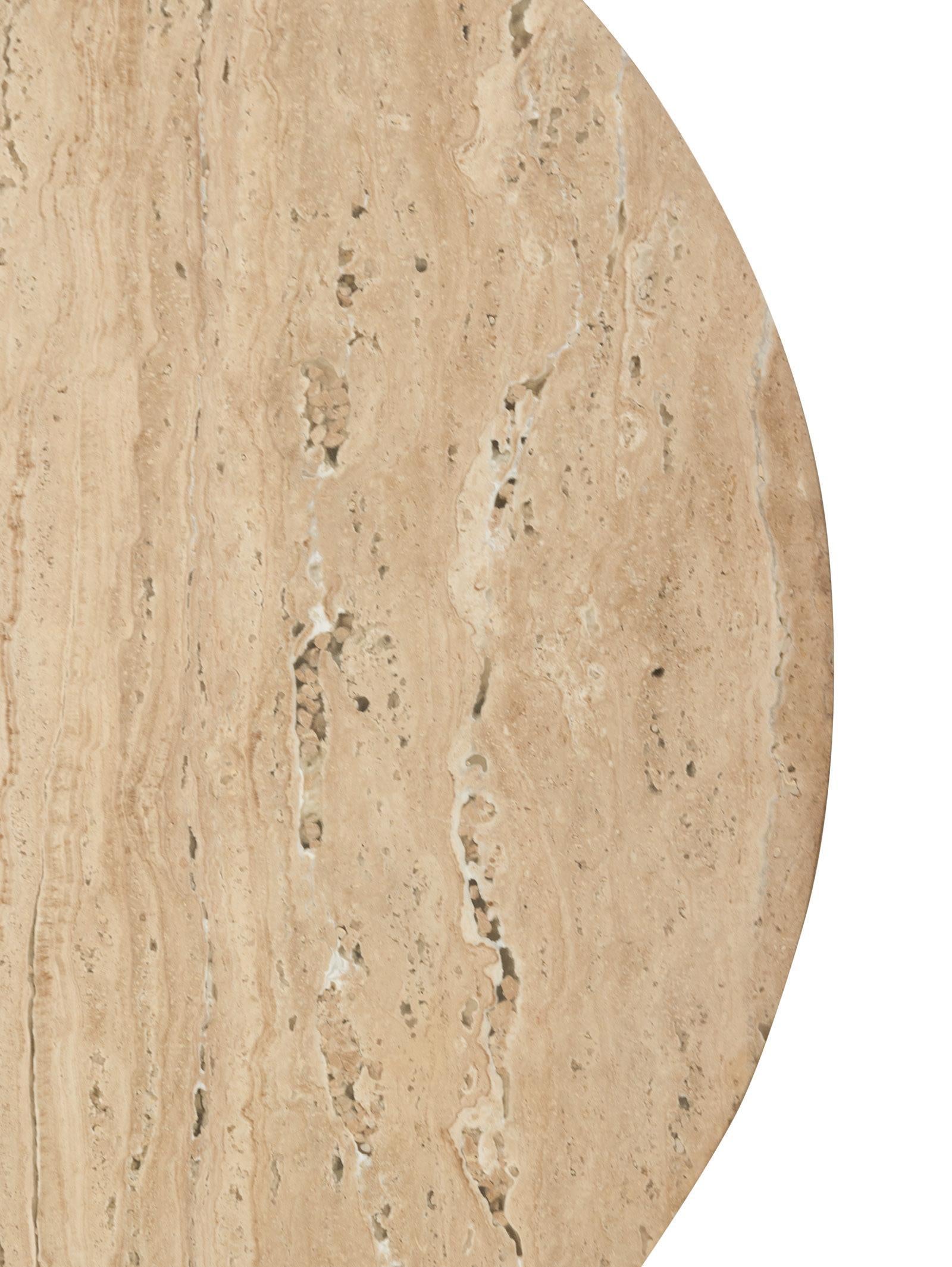 Close-up of a beige marble surface with subtle variations in color.