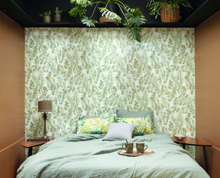 A wallpaper with a floral pattern featuring large leaves in a muted color palette, with a subtle shimmering overprint.