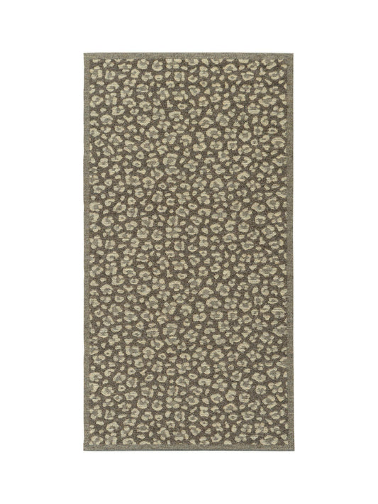 Rug with a leopard print pattern on a white background