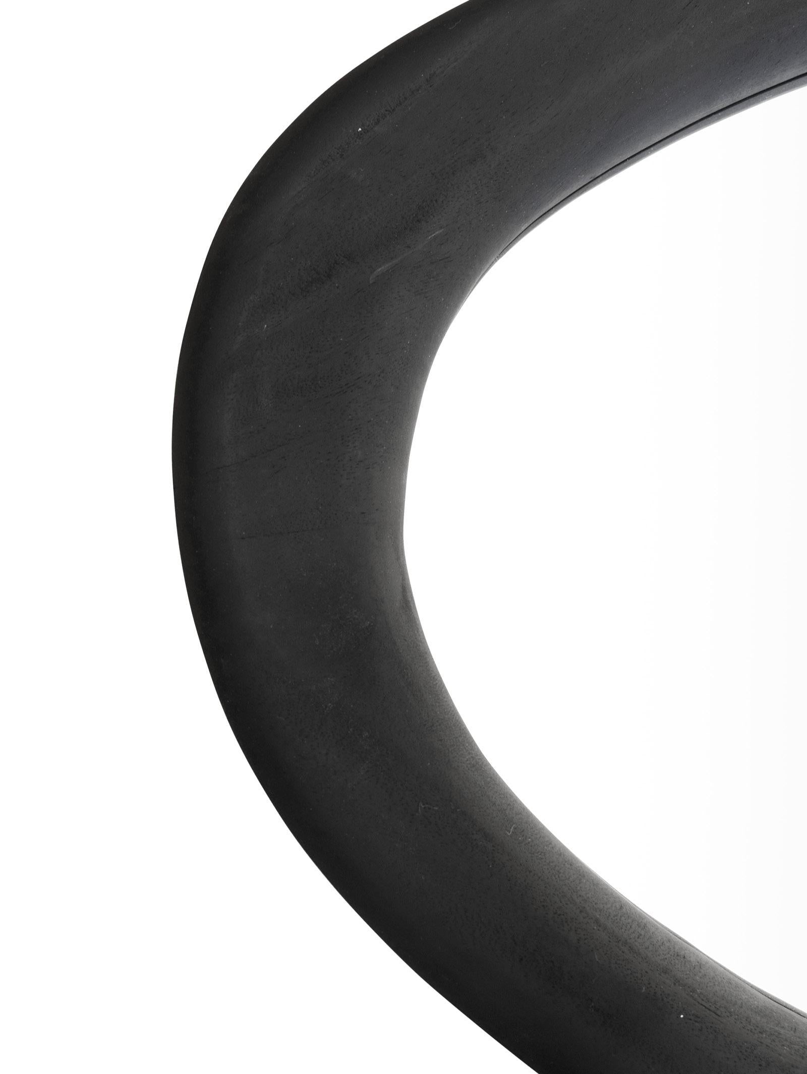 Close-up of a black wooden mirror on a white background