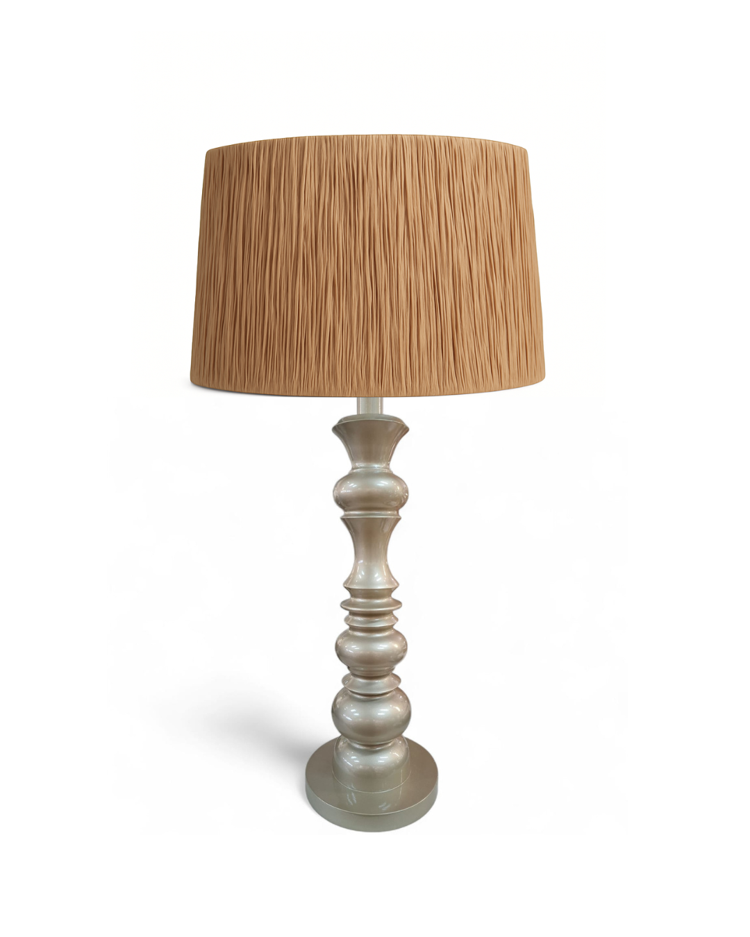 Table lamp with a textured brown shade and a decorative base on a white background