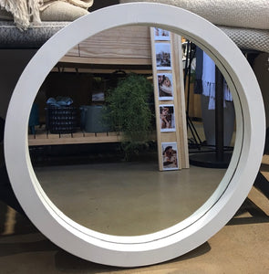 round white wooden mirror