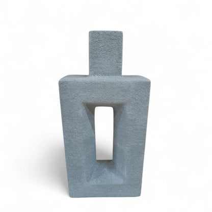 Gray textured vase with a rectangular opening on a white background
