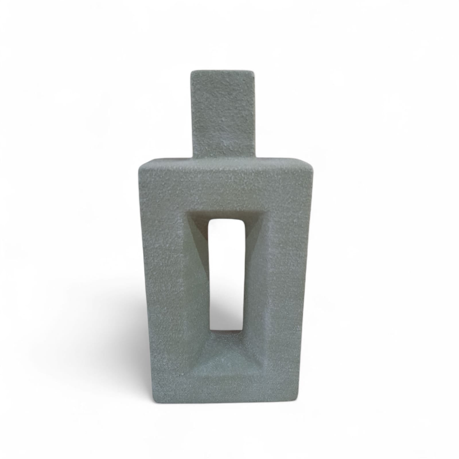 Gray textured vase with a rectangular design on a white background