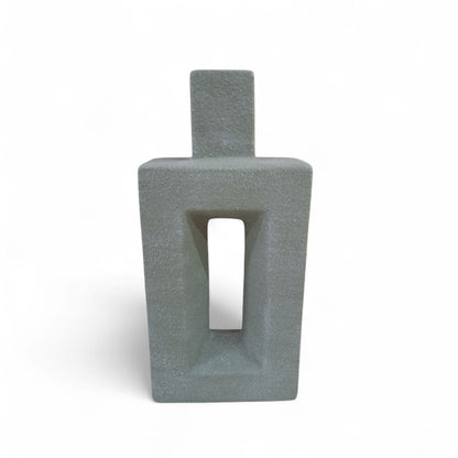 Gray textured vase with a rectangular design on a white background