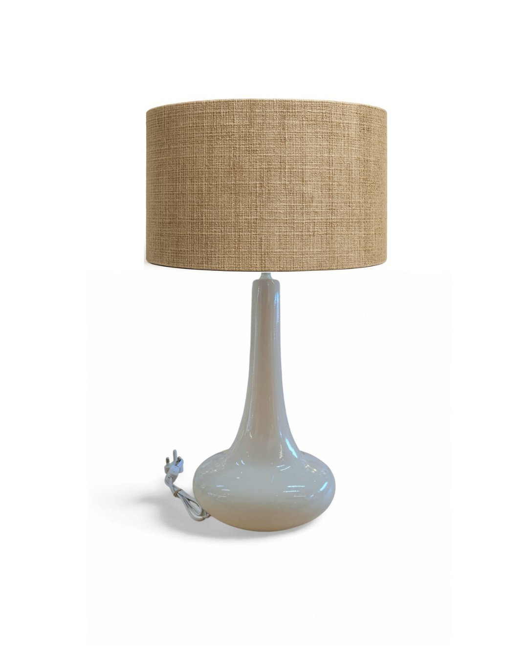 The Jill Lamp with a tall slender neck and rounded stone-gloss base.”