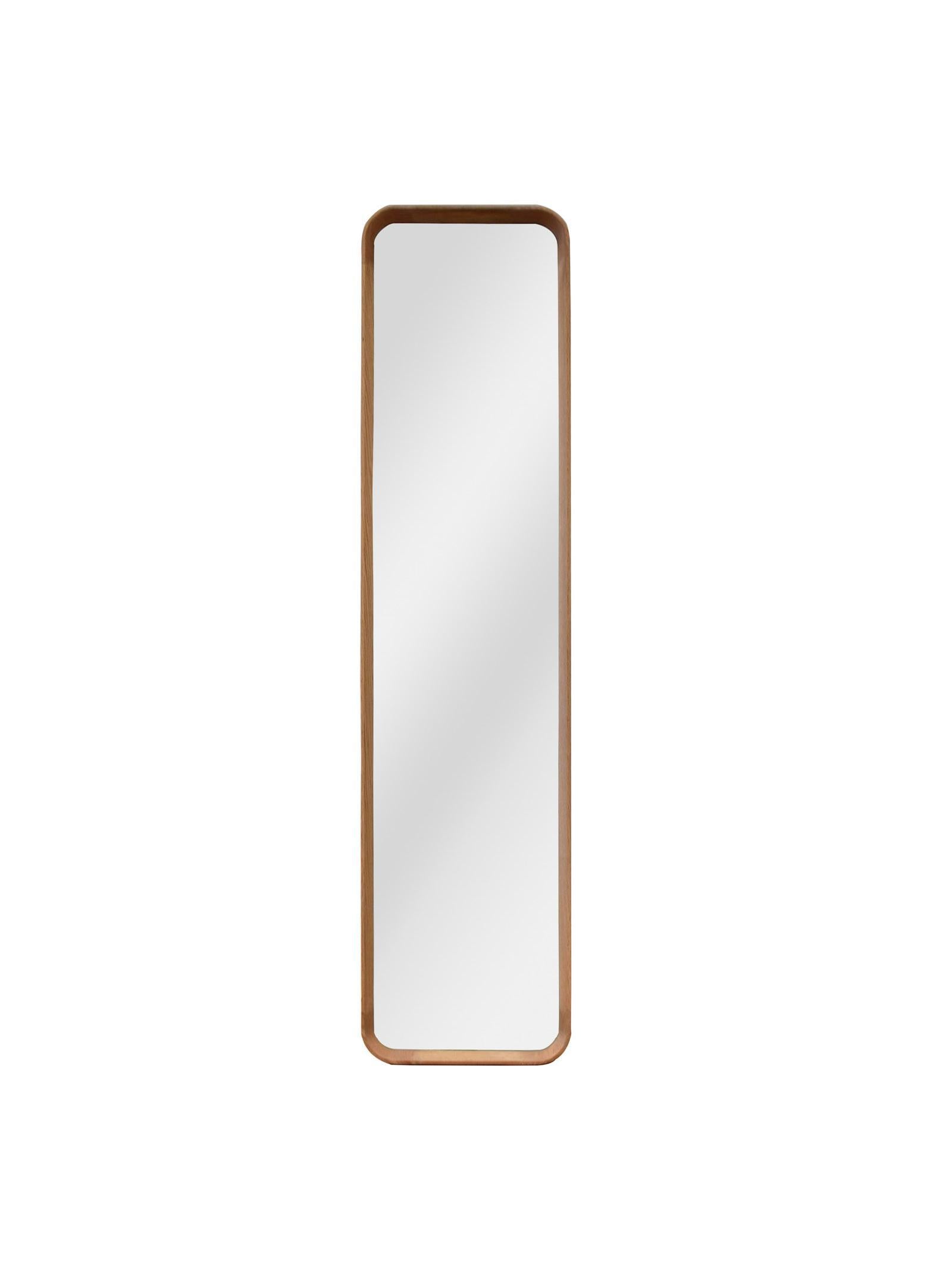 Rectangular mirror with a wooden frame on a white background