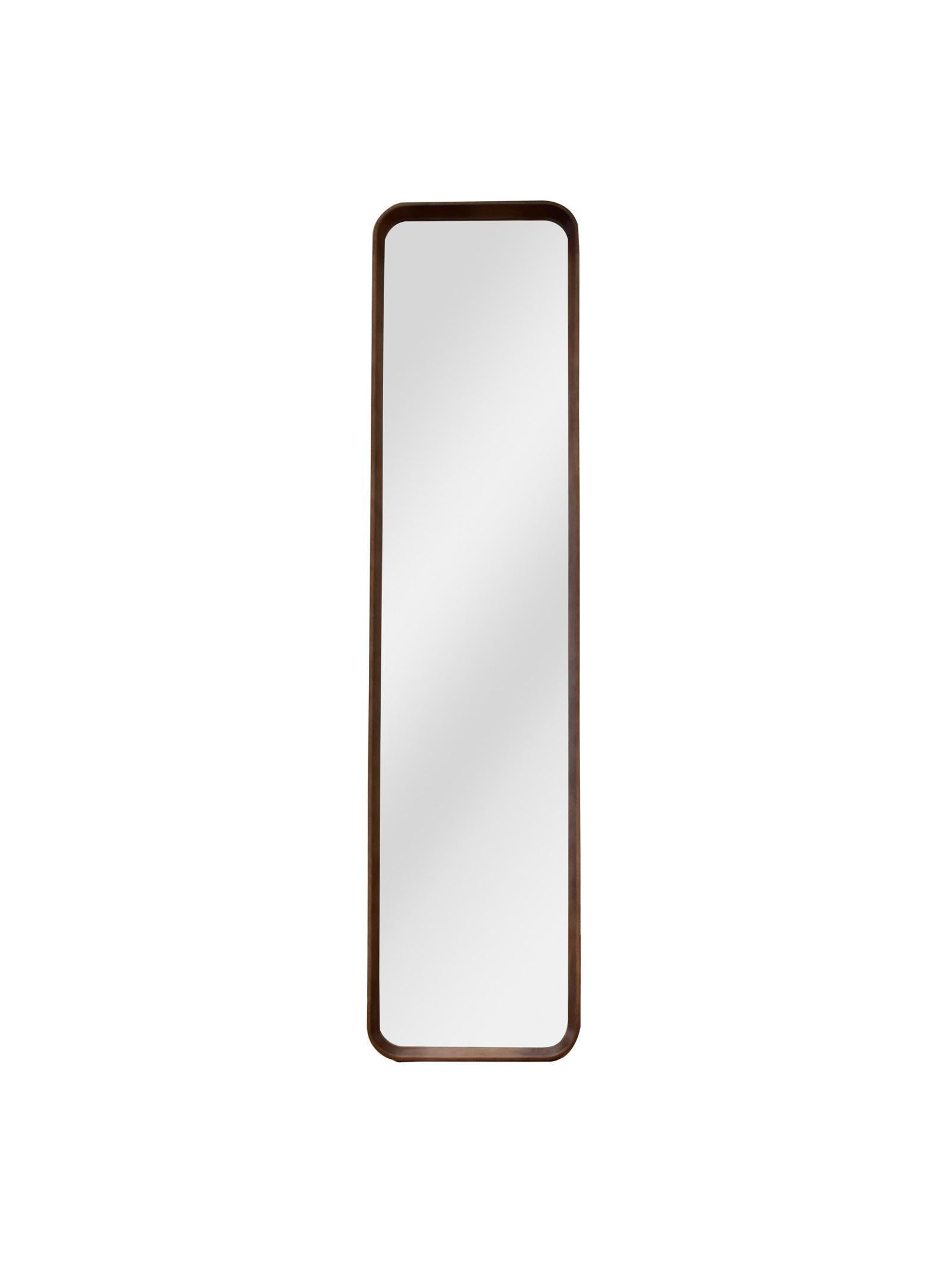 Rectangular mirror with a brown frame on a white background