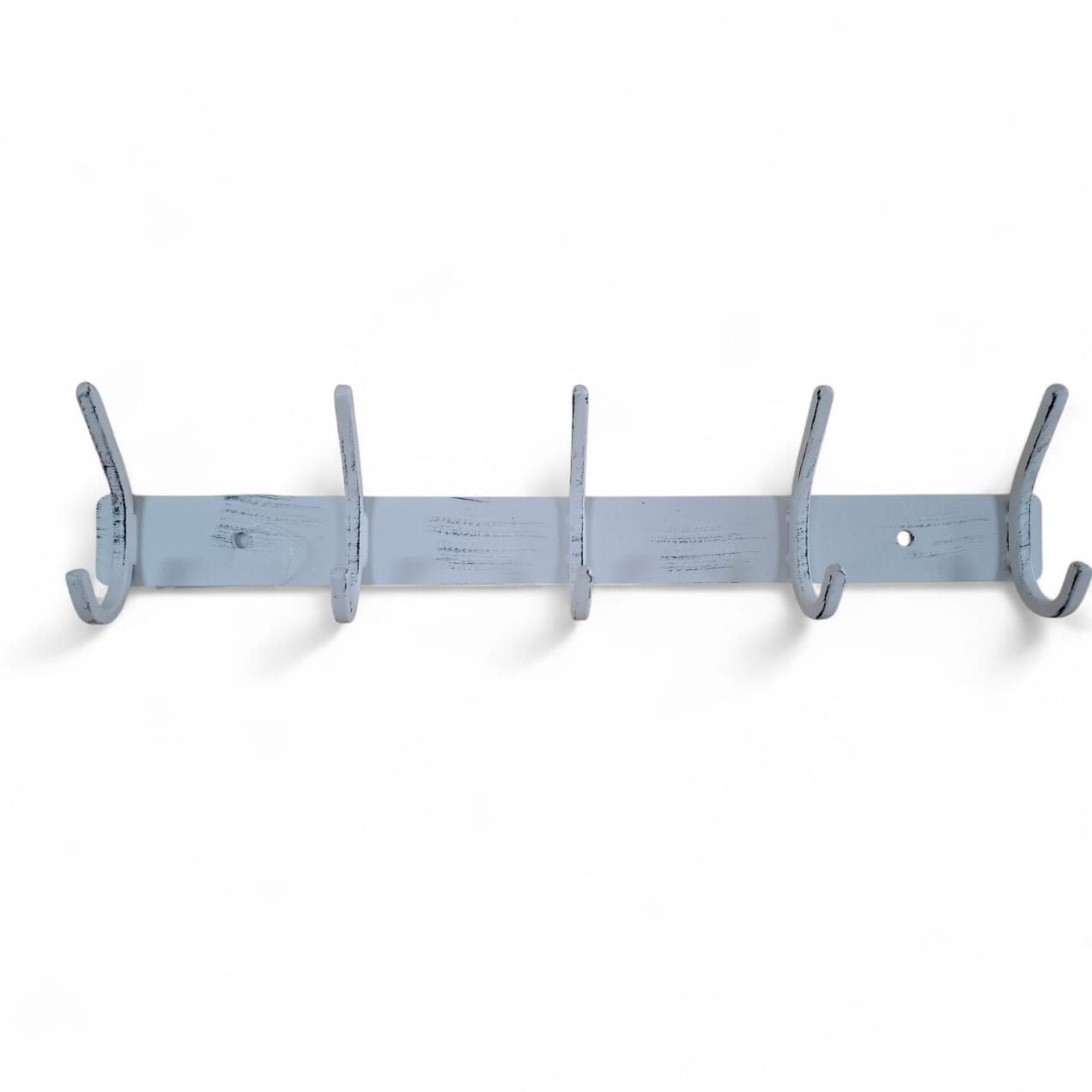 White wall-mounted coat rack with multiple hooks on a white background